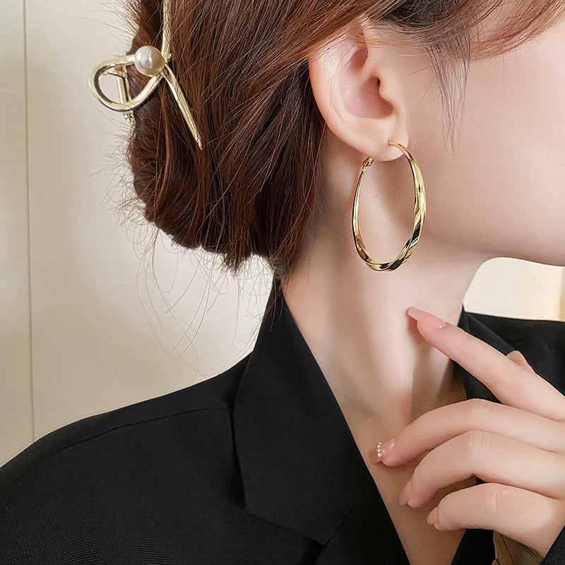 Mobius Twist Gold Hoop Earrings – Classic 50mm Statement Hoops for Women