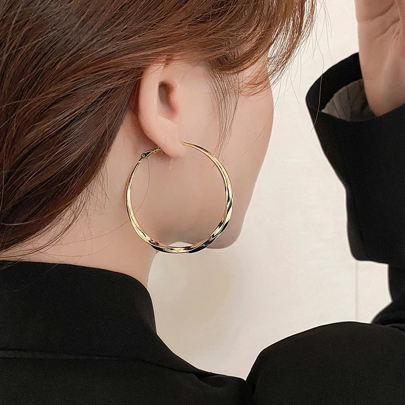 Mobius Twist Gold Hoop Earrings – Classic 50mm Statement Hoops for Women